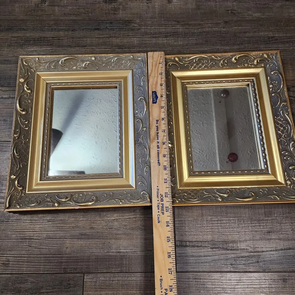 2 intricate wood framed mirrors. See damage in pictures V